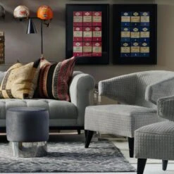 Eaves Chair -AuraLiving Furniture Store 215185 fiorella 3 seater sofa with vince charcoal with guinea trim wilder chairs eaves chairs chandler stools in orange pink and grey perplex console table and krisp desk lamp