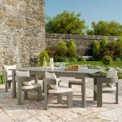 Caicos Dining Chair With Arms Outdoor Dinning Chair -AuraLiving Furniture Store 310120 caicos taupe dining chairs harlyn dining table lifestyle